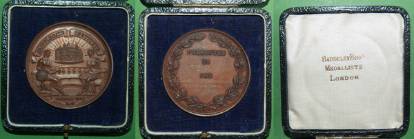A bronze medal in case with 'Baddeley Bros, Medalists London' branding, struck for the Cripplegate Foundation Charity