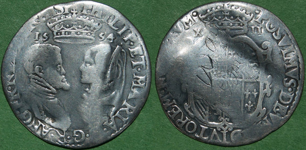 A 1554 shilling of Philip & Mary with full titles.  The flan is creased  and the reverse engraved with J Way, 155 Fore Street, Exeter.  The weight is 5.83 grams and the  obverse grades Fine with the reverse nearly so. The price is  £300.