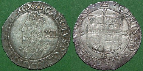 A Charles I group F large bust shilling with single arch crown and mintmark triangle, dating it to 1639-40. Cleanly struck, though a little soft in parts and weighs 5.77 grams. The grade is nearly very fine and the price is £180.