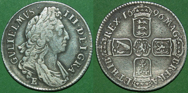 A 1696E first bust shilling struck at Exeter during the Great Recoinage of 1695-8. Good detail, but slightly pitted surfaces and light tooling in the fields. The grade is almost very fine and the price is £175.