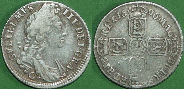 A William III 1696 first bust shilling struck at Chester. Struck slightly off-centre with weakness at the French shield and correspondingly on the obverse.  The grade is good fine and the price is £130. A scarce coin.