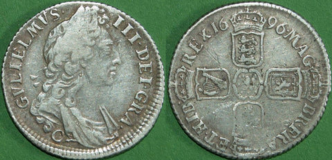 A William III 1696 first bust shilling struck at Chester. Struck slightly off-centre with weakness at the French shield and correspondingly on the obverse.  The grade is good fine and the price is £130. A scarce coin.
