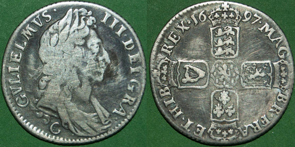 A 1697 third bust shilling struck at Chester. The portrait has scratches and the fields have been tooled. The grade is fine, but a rare coin. The price is £95.