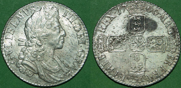 A William III 1700 fifth bust shilling with circular 0's in the date. There is a trace of wear to the high points of both sides and extensive haymarking. The grade is extremely fine and the price is £450.