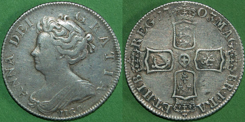 Anne 1703 second bust VIGO shilling, struck from Spanish silver captured at Vigo Bay. Toned with even wear to the higher points, the grade is almost very fine and the price is £275.