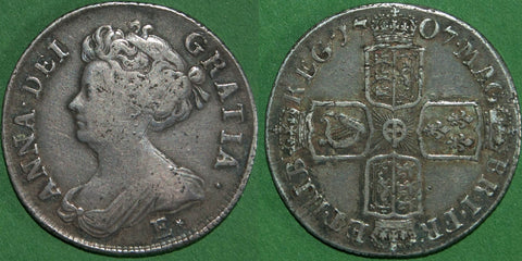 Anne 1707E* second bust shilling struck at Edinburgh from London dies with wide shields and stops after R & B (this not listed by Bull).  Toned with a couple scratches to both sides, but a decent example of this rare coin. The obverse is nearly very fine and the reverse very fine. The price is £450. 