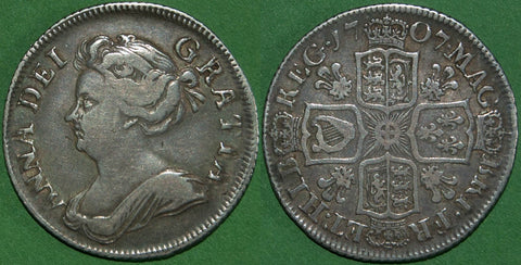 Anne 1707 third bust shilling with plumes in the reverse angles. The grade is good fine with even wear to both sides and the price is £150. A scarce coin.