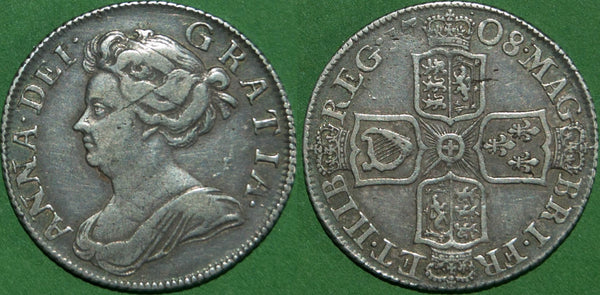 An Anne 1708 third bust shilling with plain angles on the reverse. Toned with a couple of obverse scratches, the grade is very fine and the price is £120.
