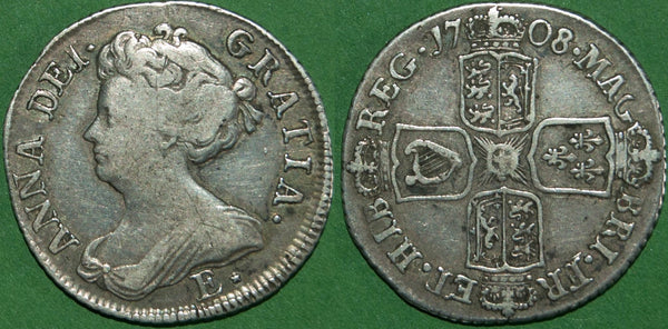 Anne 1708E* second bust shilling struck from London dies  with wide shields and a large 0. The obverse with a couple of thin scratches. Toned with even wear, the grade is nearly very fine and the price is £450. A rare coin.