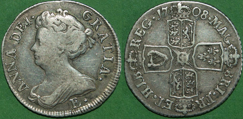 Anne 1708E* second bust shilling struck from London dies  with wide shields and a large 0. The obverse with a couple of thin scratches. Toned with even wear, the grade is nearly very fine and the price is £450. A rare coin.