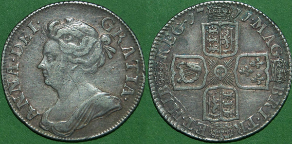 Anne 1711 third bust shilling with plain angles. This is a mule, the third bust having been superseded by the fourth bust in 1710.  Toned, the obverse with graffiti on the neck, otherwise very fine. The price is  £300. A rare coin. with maybe a couple dozen examples known.