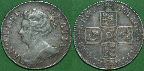 Anne 1711 third bust shilling with plain angles. This is a mule, the third bust having been superseded by the fourth bust in 1710.  Toned, the obverse with graffiti on the neck, otherwise very fine. The price is  £300. A rare coin. with maybe a couple dozen examples known.