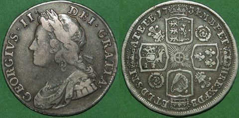 George II 1734 shilling with roses and plumes in the angles. Toned with general wear, the obverse is good fine, the reverse a bit better. The price is £150.