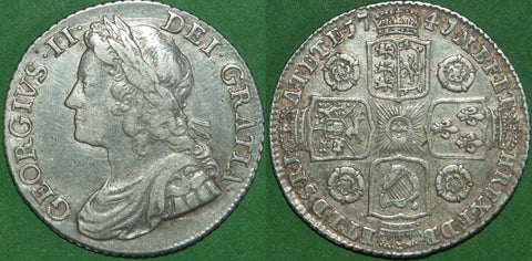 George II 1741 young head shilling with roses in the angles. Lightly toned with wear and some deposits in the devices. Graded very fine and the price is £195.
