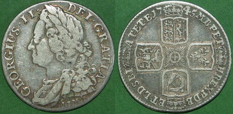 George II 1745 LIMA shilling with general wear to both sides and toned with light surface marks. The grade is good fine and the price is £60.