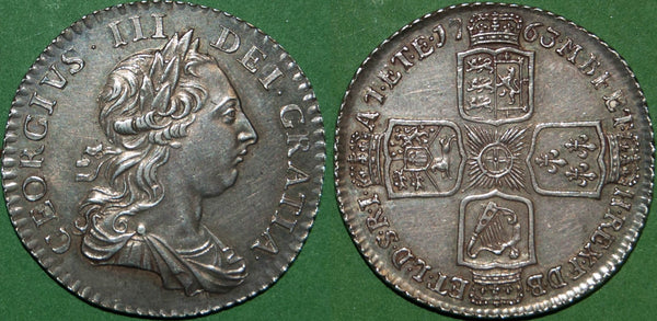George III 1763 'Northumberland' shilling. Toned with rub to the higher points, but quite attractive in hand. The grade is almost extremely fine and the price is £1200.