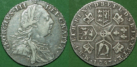 George III 1787 with hearts shilling. Toned with some scratches in the drapery and general wear. The grade is good fine and the price is £40.