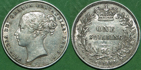 Victoria 1857 shilling with light wear and marks to both sides. The grade is good very fine and the price is £75.
