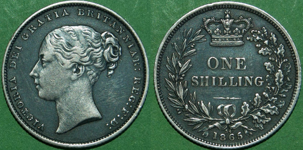Victoria 1865 shilling with reverse die number 34. Darkly toned, the relief has been cleaned resulting in a coin with eye appeal. The grade is good very fine and the price is £70.