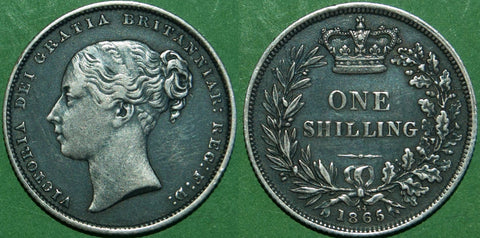 Victoria 1865 shilling with reverse die number 34. Darkly toned, the relief has been cleaned resulting in a coin with eye appeal. The grade is good very fine and the price is £70.