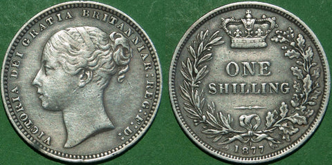 Victoria 1877 shilling with die number 1. General wear with multiple small contact marks and has been cleaned. Grades very fine and the price is £35.
