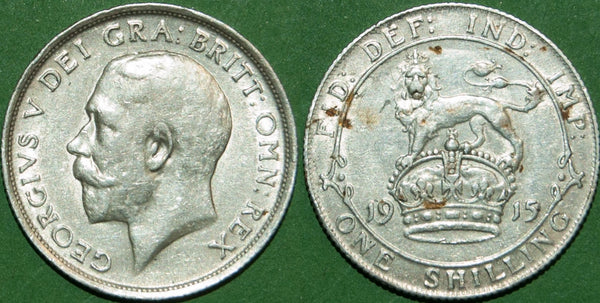 A 1915 first coinage shilling with light wear and some deposits on the reverse. Almost extremely fine and the price is £22.