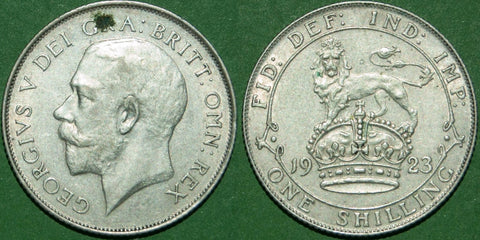 A 1923 shilling with minimal wear and an obverse verdigris spot above the head. Grades extremely fine and the price is £35.
