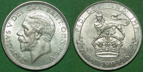 A 1926 modified effigy third coinage shilling with just a hint of friction to the cheekbone and lion's mane. Grades good extremely fine and the price is £40.