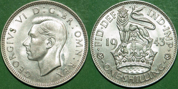 A 1943E shilling, practically as struck, with a small spot on the obverse S. The price is £15.